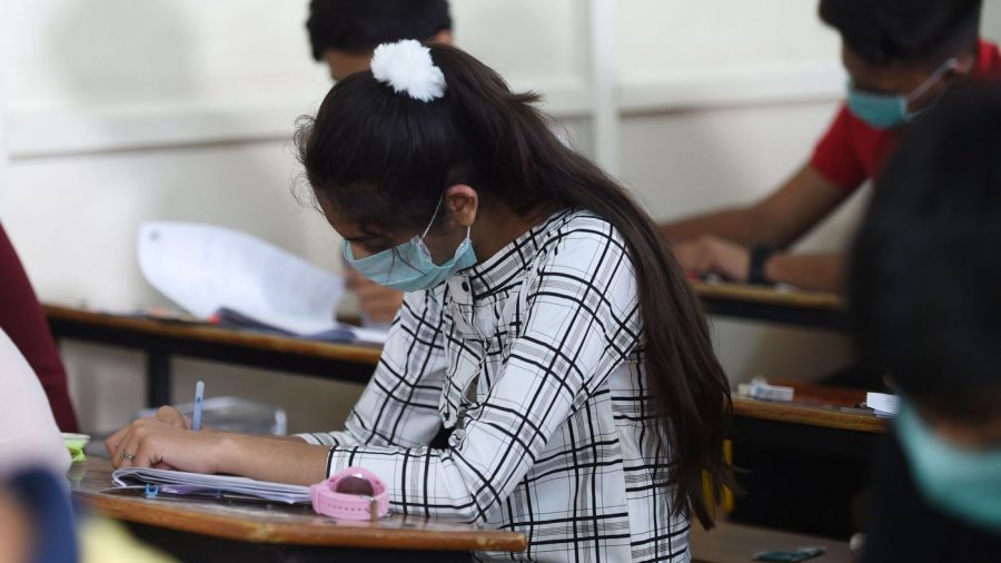 Students sit for an exam in Ahmedabad, India, on Thursday. In the nations capital, New Delhi, all primary schools have been ordered closed until March 31 because of coronavirus concerns.