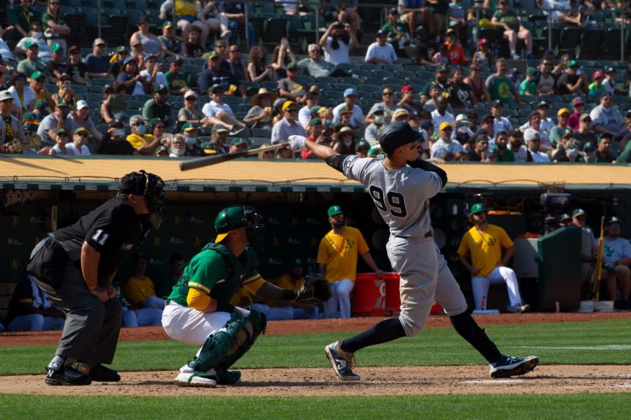 Oakland, California - August 28, 2021: #99 Aaron Judge of the New York Yankees hits a 9th inning home run against the Oakland Athletics at Ring Central Coliseum. Printed with permission of https://www.shutterstock.com/g/ConorFitzgerald/about