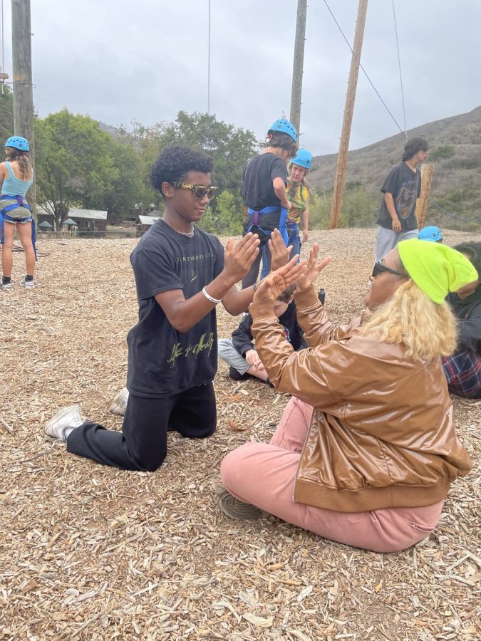 Aaryan Medhi Williams ’27 and librarian Jehan Giles play a fun game at the ropes course on retreat at El Capitan Canyon.