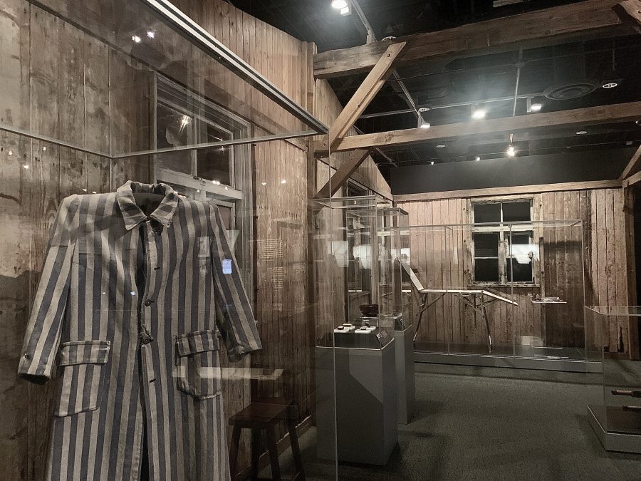 A prisoners coat on display along with other artifacts.
