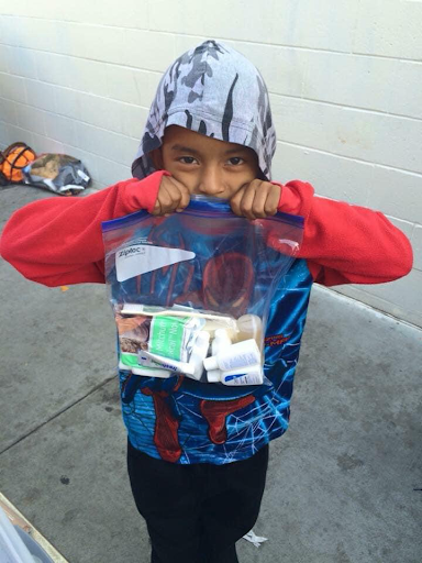 Child receives hygiene packet .