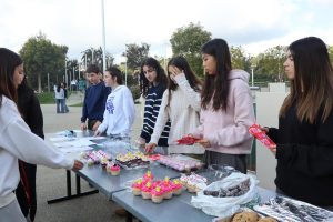 Community service club bake sale raises funds for fire relief