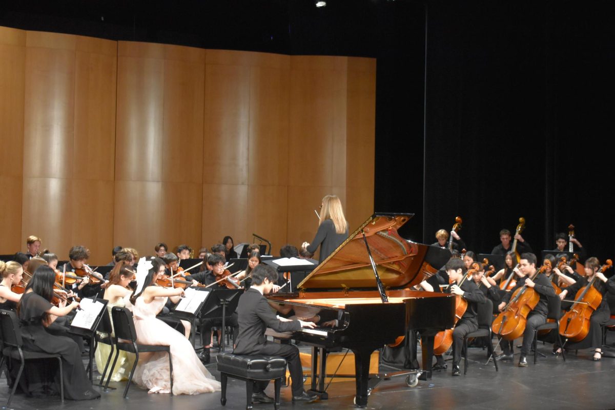 Isaac Fujikawa ’29 performs “Rachmaninoff: Piano Concerto No.2” with the Middle School Symphony, conducted by Emily Reola. 