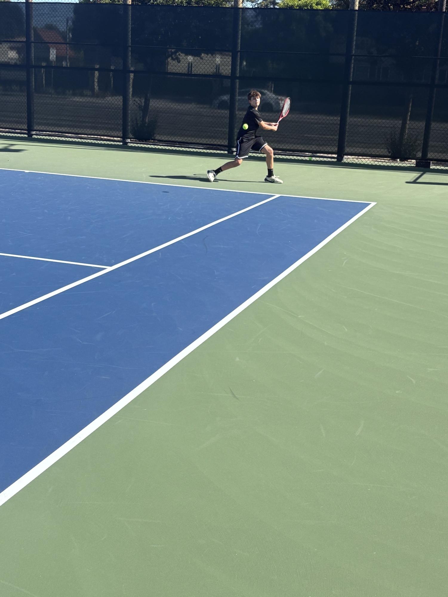 BOYS BLACK TENNIS TEAM PREVAILS OVER OAKWOOD TO FINISH OFF UNDEFEATED REGULAR SEASON
