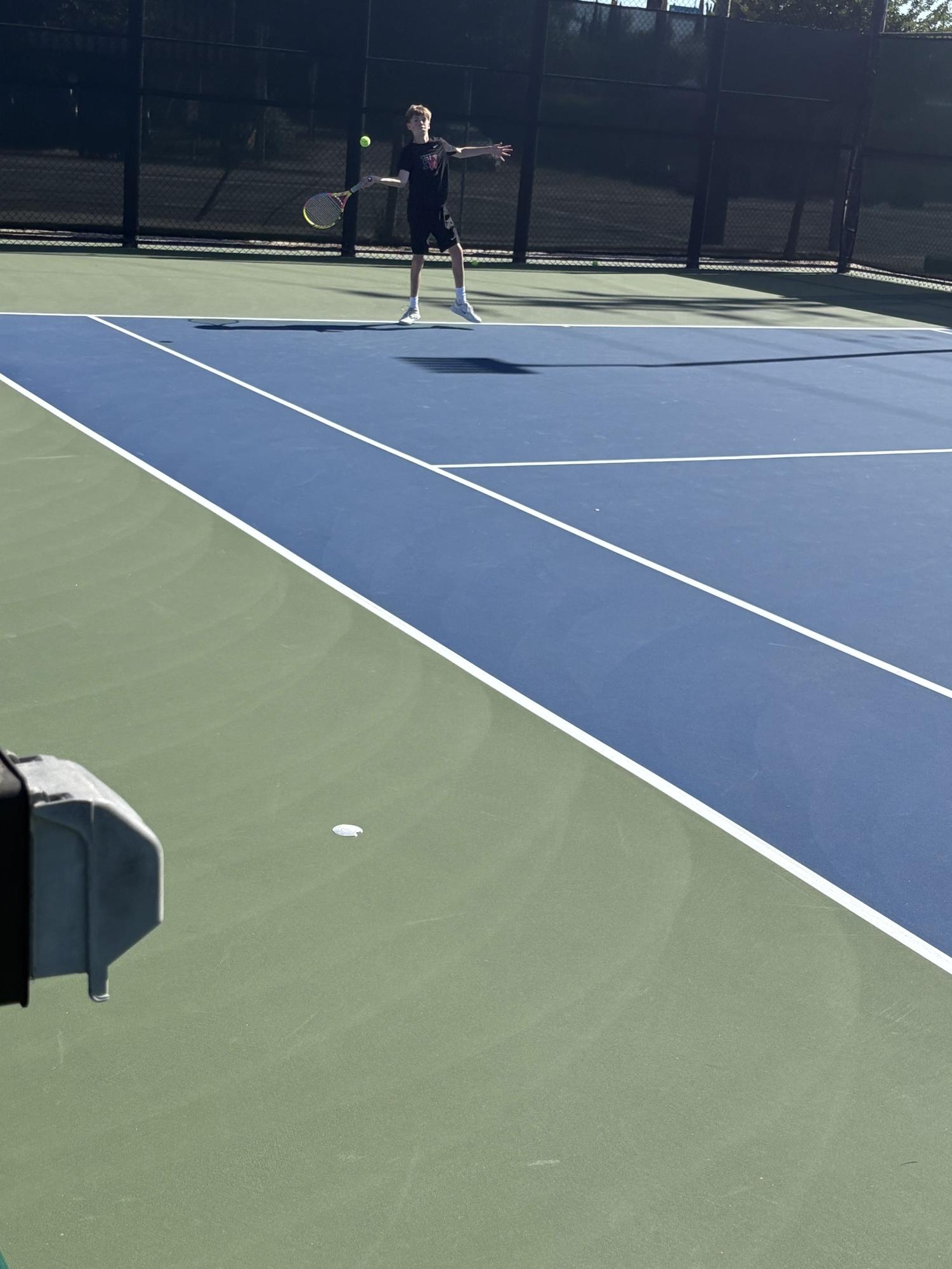BOYS BLACK TENNIS TEAM PREVAILS OVER OAKWOOD TO FINISH OFF UNDEFEATED REGULAR SEASON